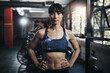 © peopleimages.com - Girl, portrait and confidence in gym for exercise, bodybuilding and personal training for health or muscle strength. Female person, serious and proud for active living, fitness and cardio workout.