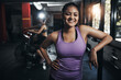 © peopleimages.com - Girl, portrait and happy in gym for fitness, bodybuilding and personal training for health or muscle strength. Female person, arms crossed and proud for active living, exercise and cardio workout.