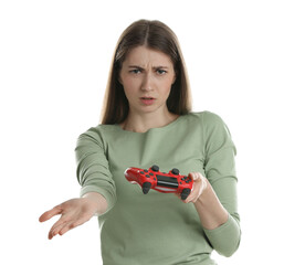 Wall Mural - Unhappy woman with controller on white background