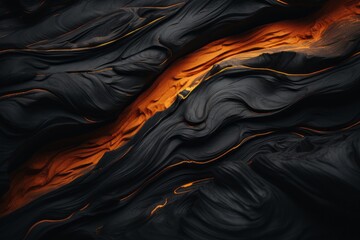 Wall Mural - an abstract black and orange lava flow on a black background