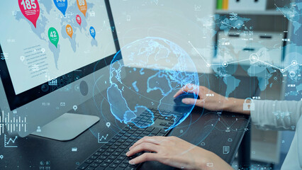 A woman using computer in office and digital communication network concept.