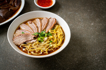 Sticker - egg noodles with stewed duck in brown soup