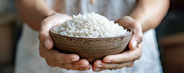 a person with a traditional bowl of white rice