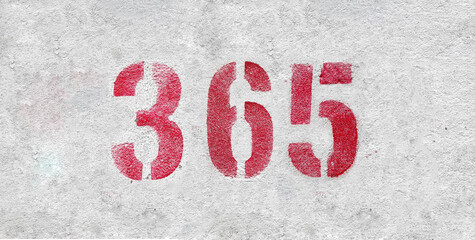 Red Number 365 on the white wall. Spray paint.