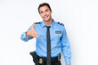 © luismolinero - Young police caucasian man isolated on white background shaking hands for closing a good deal
