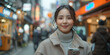 © Taria Technology - Korean Businesswoman on City Street