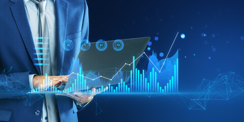 Poster - A man in a suit interacts with futuristic digital graphs and data projections on a blue technology-themed background, symbolizing digital business analysis