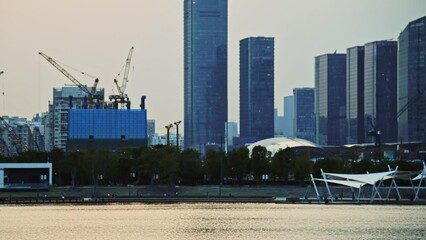 Wall Mural - Time lapse of skyscrapers and unfinished building in the city