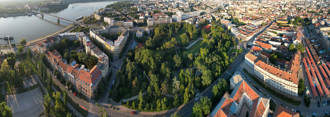 Wall Mural - Panoramic aerial view of Novi Sad, Dunavski park and Danube river on sunny summer morning. Serbia.