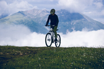 Wall Mural - Riding mountain bike on beautiful mountain top