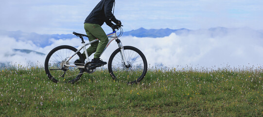 Wall Mural - Riding mountain bike on beautiful mountain top