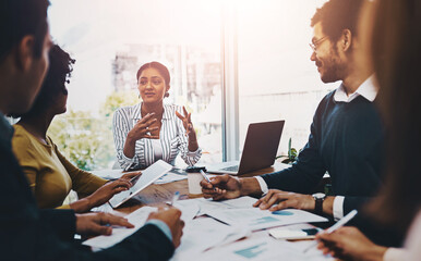 Canvas Print - Business people, paperwork and discussion in meeting with data analysis on market research and company infographic. Teamwork, diversity group and strategy on target growth and brainstorming of stats