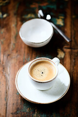 Wall Mural - Cup of coffee on wooden background. Close up.	