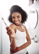 © peopleimages.com - Home, portrait and woman with dental hygiene for oral care, morning routine and teeth cleaning. Bathroom, smile and happy female person with product for gum health, satisfaction and plaque removal
