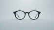 © Arslan - A stylish pair of eyeglasses on a white background