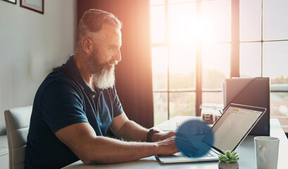 Poster - Mature CEO, businessman and typing on laptop in office for feedback email, company review and website update. UX designer, bokeh and technology at desk to monitor online software and app development