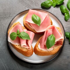 Wall Mural - A plate of sandwiches with ham and cheese and basil on top 