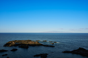 Wall Mural - Atlantic Ocean and La Gomera Island view from Tenerife Island Spain at sunset