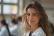 © PHAISITSAWAN - Photograph of a woman doctor, nurse, portrait shot smiling cheerfully, standing front row in class.
