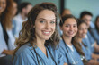 © PHAISITSAWAN - Photograph of a woman doctor, nurse, portrait shot smiling cheerfully, standing front row in class.