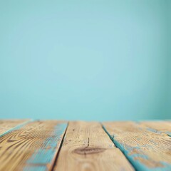 Wall Mural - Rustic wooden table against a light blue background. Ideal for product display and design mockups.