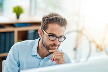 Leinwandbilder - Glasses, reading and man in office, computer and market research for social media manager, online and smile. Thinking, digital and working for agency, ideas and goal of project in morning and desk