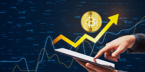 Wall Mural - Close up of businessman hand pointing at cellphone with golden bitcoin arrow and index on dark background. Cryptocurrency and financial growth concept.