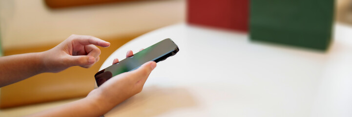 Poster - Hands of woman using mobile phone for online shopping