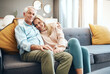 © Penn/peopleimages.com - Portrait, mature couple and hug on sofa for relax together, bonding and partner support in home. Man, woman and love embrace on couch with care, romantic time and relationship trust in living room