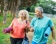 © Lumos sp - woman man couple happy mature together active fit fitness park outdoor healthy talking leisure park love old nature bonding middle aged exercise mat yoga pilates