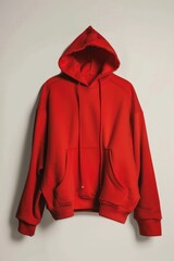 Poster - A single red hoodie hangs on a white wall, simple and straightforward