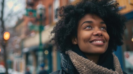 Canvas Print - A cheerful woman with an afro hairstyle smiling directly at the camera