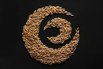 Poster - A close-up shot of a spiral-shaped wheat on a dark or black background, ideal for use in designs related to food, nature, and agriculture