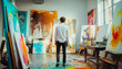© Steven - Male artist in a studio filled with abstract paintings and art supplies indicating creativity and artistic work.
