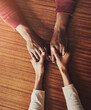 © TamJam/peopleimages.com - Couple, holding hands and above for support in home for care, connection and empathy for mental health. People, comfort and partner for help with kindness, bonding and solidarity for grief on table