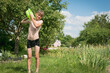© Сергей Старостов - A little boy is doused with water in the courtyard of a country house