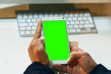 Poster - Office, hands and smartphone with green screen in desk for mockup space, advertising and promotion. Business, person and employee on internet for website research, communication and digital promo