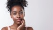 © SC Media - Beautiful Afro american woman with flawless skin. Skincare concept. Beautiful young black girl practicing skincare. smooth face touches her healthy facial skin. Copy space for text.