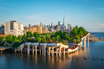 Wall Mural - Long exposure of Little Island over the Hudson River in Chelsea, New York, with the lower Manhattan skyline as a stunning backdrop at dusk.