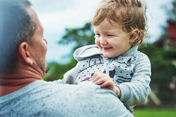 Wall Mural - Smile, dad and girl outdoor with love for bonding, affection and protection with safety or care on rainy day. Father, female child and embrace or together with support, security and trust with hug.