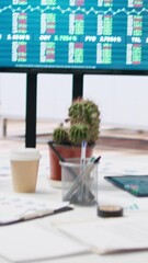 Poster - Vertical video Market index listings values going up and down on monitor, price volatility concept. Broker trading economic analytics figures on big screen in empty workspace, camera A close up shot