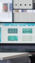 Poster - Vertical video Financial analyst workplace featuring laptop and tablet displaying stock exchange data and statistics. Close up shot of devices on desk next to paperwork with forex trading economic