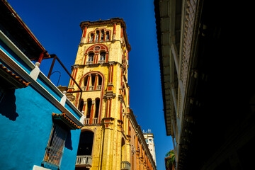 Wall Mural - Tower of the University of Cartagena seen from an alley in Cartagena de Indias, Colombia