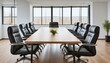 © Jay Nandu - A spacious conference room with a long wooden table, modern black leather chairs, and large