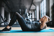 © ReeseArcurs/peopleimages.com - Woman, sit ups and workout in gym with fitness for muscle mass, core strength or abs training on mat. Athlete, person and abdomen exercise for calorie burn, crunches or healthy body in sports club