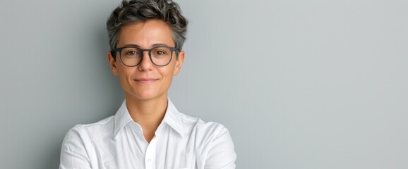 a confident LGBTQ+ individual in professional attire, clear white background, natural lighting