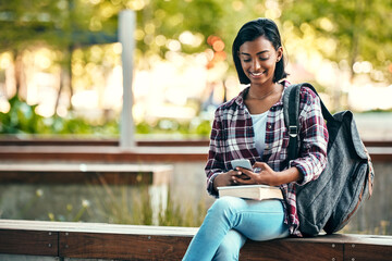 Canvas Print - Girl, university student and phone with backpack, outdoor or education with smile for walking at campus. Indian person, happy and smartphone with books, texting and chat on social media at college