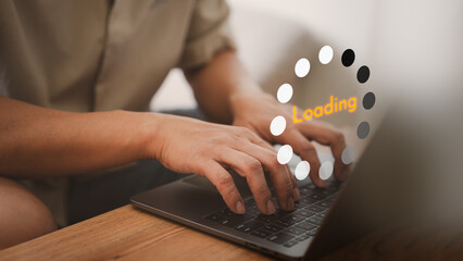 Poster - Man working on a laptop computer, downloading and updating software, while waiting for digital files to load from a website. Slow internet from wifi causes delays. Concept of loading and waiting.