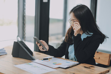 Wall Mural - Asian woman working at the office. woman using laptop computer on desk at office