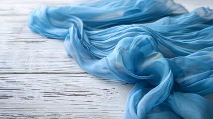 Wall Mural - Blue tablecloth on a white wooden table surface with copy space.